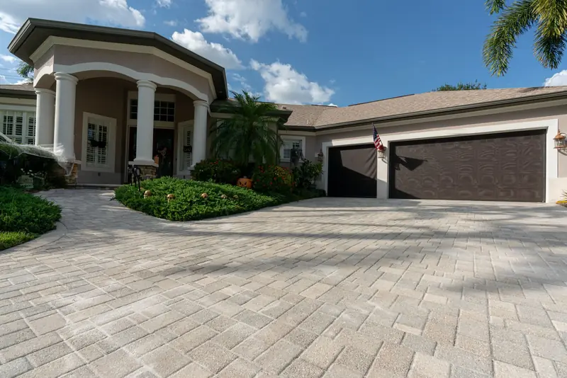 A sealed paver driveway in front of a Florida home